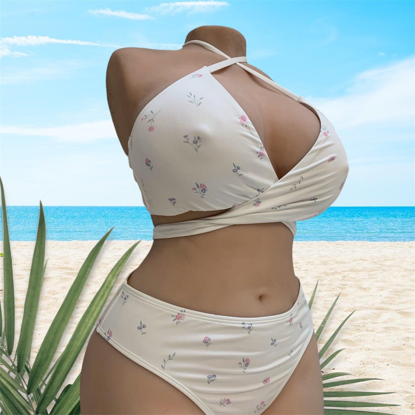 Torso doll Tantaly wearing a white bikini with floral pattern. Elegance and sensuality guaranteed!