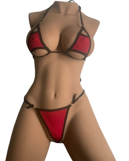 Bikini in red and black featuring a unique cutout design, perfect for beachwear or poolside lounging.